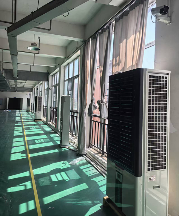 制衣厂整体降温，应用蒸发冷省电空调-立式轴流双风口机组
